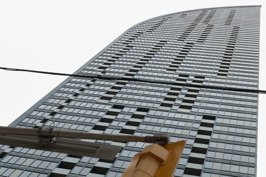 skyward view of L-Tower, a 58-storey condo in downtown Toronto, designed by Daniel Libeskind, 2015, feat "swooping" facade