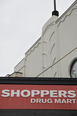 Fototapeta premium exterior building facade and sign of Shoppers Drug Mart, a pharmacy chain, located here at 1601 Bayview Av, East York, Toronto