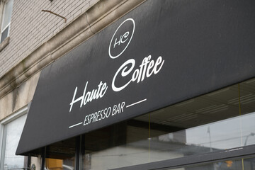 Fototapeta premium exterior building and awning sign of Haute Coffee, an espresso bar, located at 153 Dupont St, Toronto