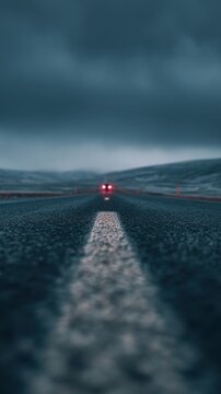Car Driving on Empty Mountain Road with Strong Leading Line