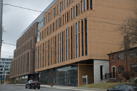 exterior of Leaside Common, designed by BDP Quadrangle, with dark and light brickwork with central glass atrium, at 1720 Bayview Av, Toronto