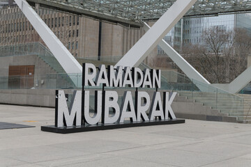 Fototapeta premium Ramadan Mubarak sign at Nathan Phillips Square, City Hall, 100 Queen St W, Toronto
