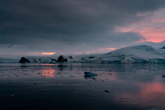 Sunrise, Charcot Bay Zodiac cruise Antartica with lots of icebergs