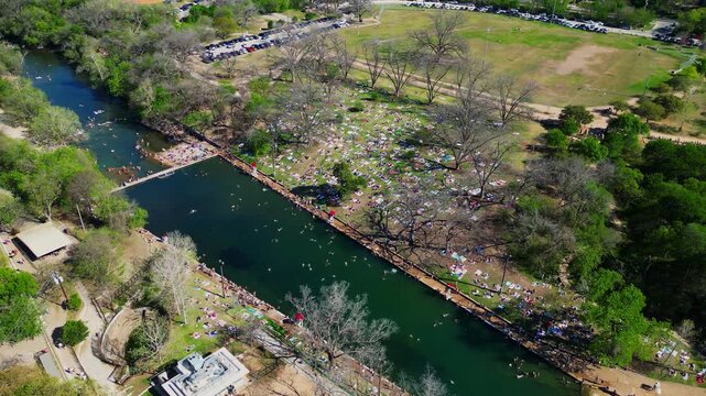 Barton Springs Pool in Austin, Texas with People Swimming and Sunbathing
