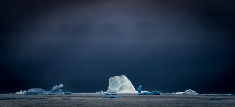 Sunrise, Charcot Bay Zodiac cruise Antartica with lots of icebergs