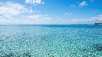 Fototapeta premium Serene Ocean View with Clear Blue Water and Bright Sky for Travel and Nature Themes