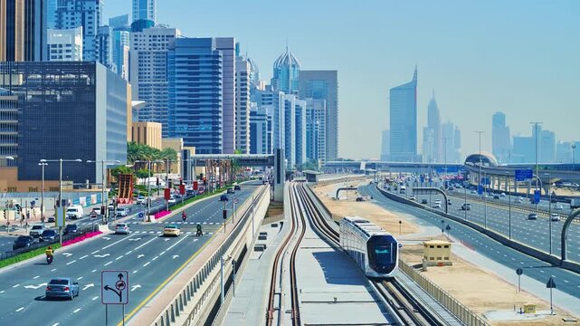 Timelapse of modern tram and car traffic in Dubai Marina, UAE