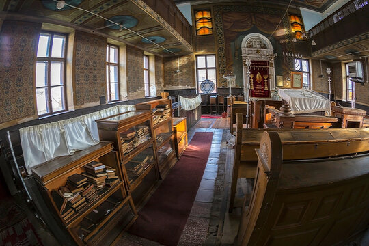 ORADEA, ROMANIA - JANUARY 27, 2018: Inside of one small Orthodox Synagogue with lots of books in the Hebrew language.