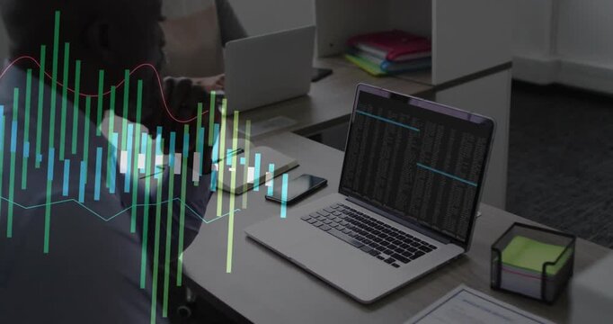 Vertical video: Leaning man in shirt watching laptop at desk as data graph rising left, copy space