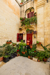 Fototapeta premium Charming Mediterranean house facade nestled in historic Mdina, Malta