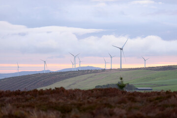 Wind energy turbines generating clean power on welsh hills © Jake Gardener