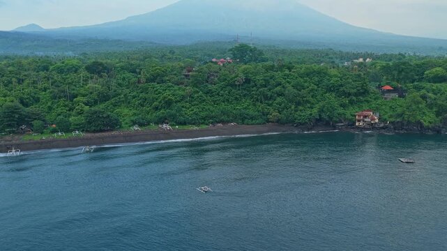 Aerial view of mount agung volcano and amed beach, bali, indonesia