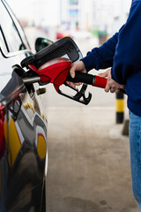 Fuel pump inserted into tank during refueling. © Rabizo Anatolii