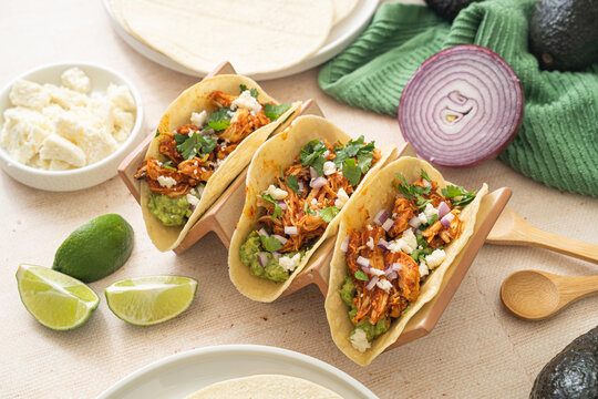 Easy slow cooker chicken tinga tacos. Spicy Mexican food 