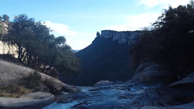 Panoramic view of the stunning Catalonian mountain landscape from the top of Salt de Sallent waterfall near Rupit
