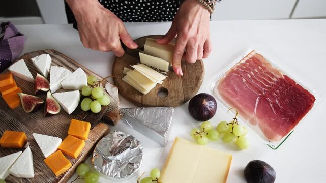 Girl Slicing Parmesan Cheese On A Board For A Cheese Board