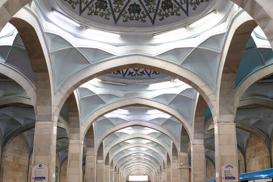 Low angle view of the ornate domed ceiling and white marble arches with traditional patterns at Alisher Navoiy subway station, Tashkent (Toshkent), Uzbekistan (O'zbekiston)