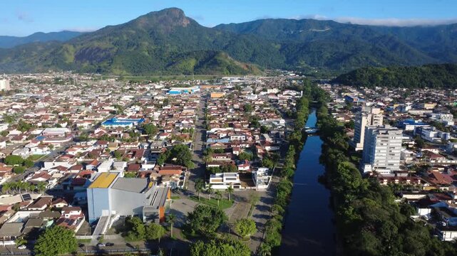 Aerial View of Coastal City with River and Serra do Mar Mountains Caraguatatuba S&atilde;o Paulo Brazil 4K