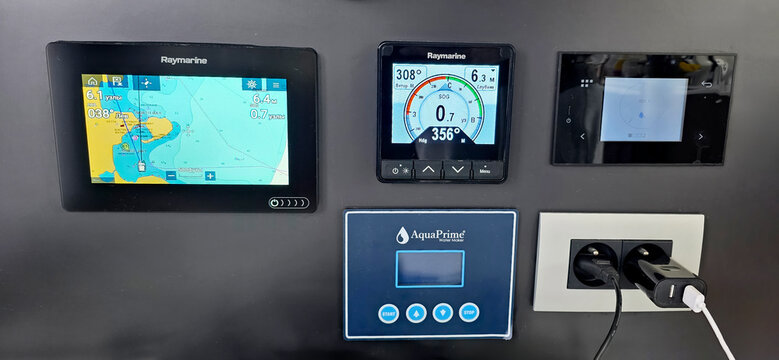 Raymarine navigation display panels with AquaPrime control unit on wall