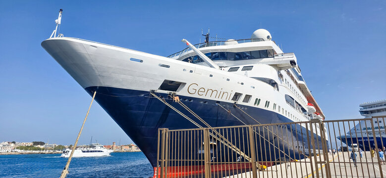 Luxury cruise ship Gemini docked at harbor with clear blue sky