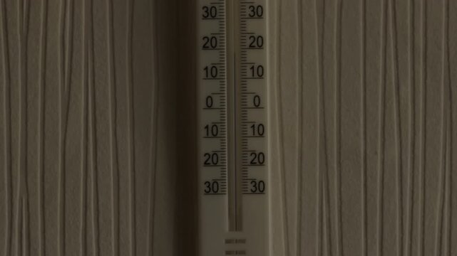 Home temperature gauge visualization. Indoor thermometer with scale indicating average room temperature on wallpapered wall
