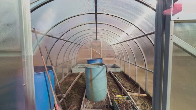 Empty farming environment. Winter greenhouse with tools. Indoor farming space with planting equipment
