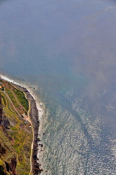 Majestic aerial perspective of Cabo Girao cliffs meeting the vast atlantic