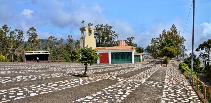 Serene courtyard with a modern chapel and mosaic floor in Cabo Girao, Madeira, Portugal