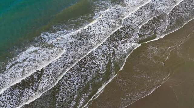 Aerial drone view of a sandy beach on the English Channel coast of Normandy, France. High quality 4k footage
