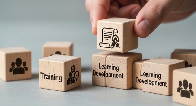 Training and Learning Development. Wooden blocks with human icons, placing a certification block on top, symbolizing structured training, skills development and organized learning pathways