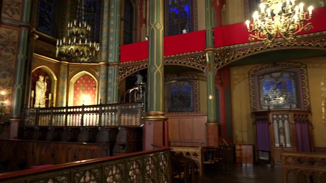 Church altar and side chapel with statues chandeliers Paris France