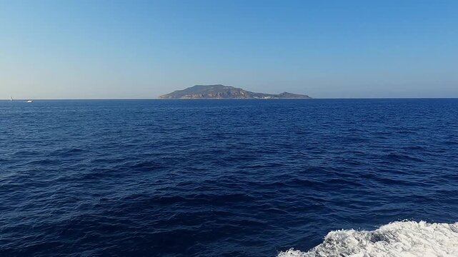 View of Levanzo Island off the coast of Sicily, from a moving boat. Italy