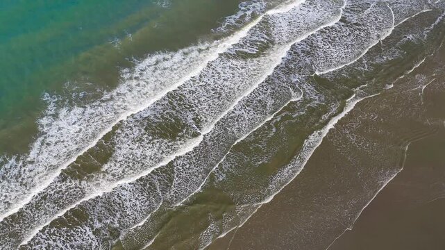 Aerial drone view of a sandy beach on the English Channel coast of Normandy, France. High quality 4k footage
