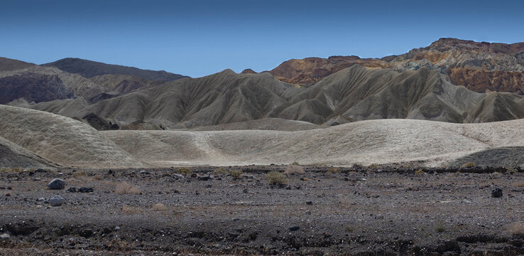 horizontal photo of geographical features sculpted by erosion in the Furnace Creek area of Death Valley National Park in California