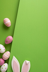 Fototapeta premium Happy Easter celebration with pastel eggs and bunny ears on a bright green background