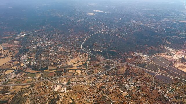 High altitude view of agricultural fields and scattered settlements