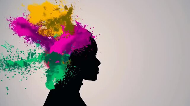 Silhouette of a person's profile with colorful paint explosion emerging from the head