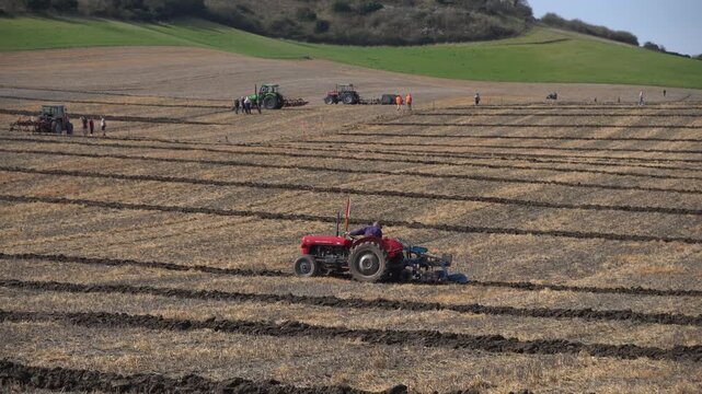 Overview of a ploughing match in progress in Wiltshire