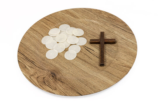 Communion Wafers and Wooden Cross on Plate Top View