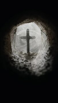 Cave filled with fog swirling around a crucifix in the opening of the empty tomb. Symbolic of the resurrection of Jesus Christ. Good Friday, He is Risen concept. Symbolizing faith or belief. Loop.