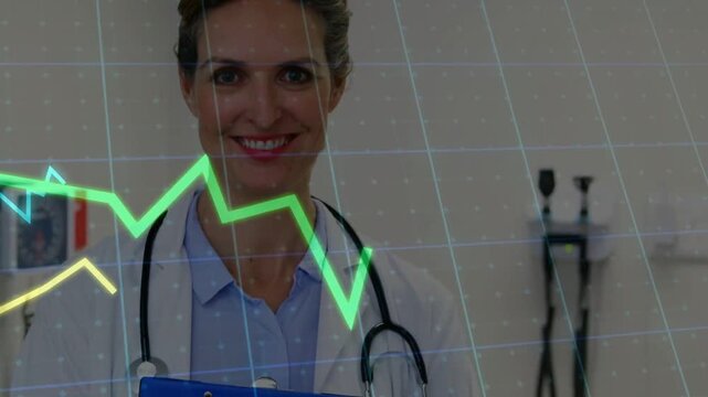 Vertical video: Doc holding blue clipboard camera rising showing steth ECG graphs on face smiling