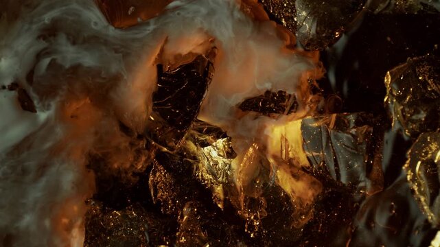 Super Slow Motion Shot of Swirling Cream Mixing in Coffee with Ice Cubes at 1000fps.