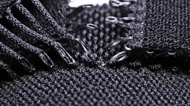 Detailed Close Up of Black Fabric Zipper Being Closed