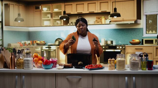 Food content creator filming avocado on toast recipe with toaster on counter, preparing bread to toast in the kitchen. Woman chef demonstrates meal prep and cooking process, food vlog.