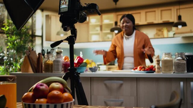 African american influencer, cooking video, recipe at home, behind the scenes, filming step by step cooking process and meal preparation. Creating content for social media platforms.
