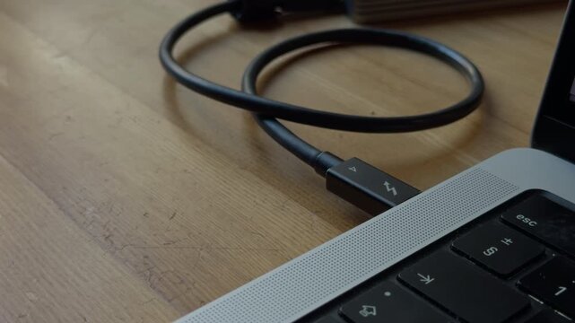 Clutterfree environment with electronic accessories. Modern office setting featuring cable and device arrangements