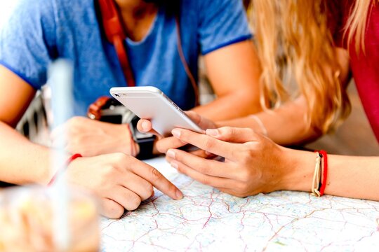 Friends planning travel adventure together