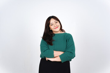 Fototapeta premium Confident and smiling young asian woman with arms crossed