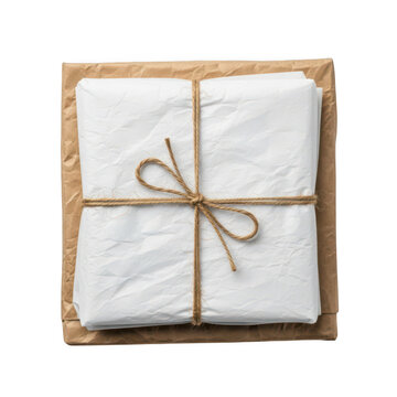 Stack of paper wrapped in brown kraft paper with a twine string bow, isolated on transparent cutout png.