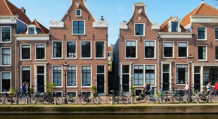 Obraz premium European canal houses with bicycles and waterfront view
